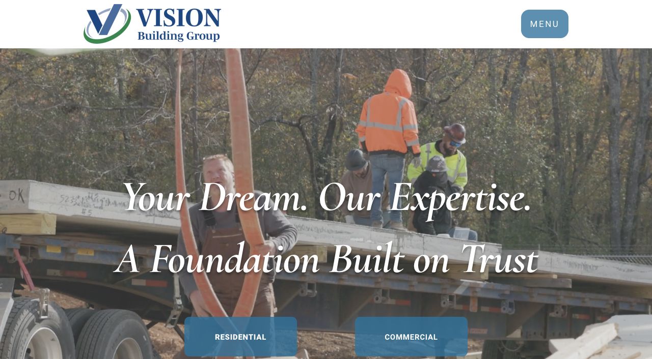 Earlier VBG homepage with a construction video background, broad trust-focused headline, and residential and commercial links.